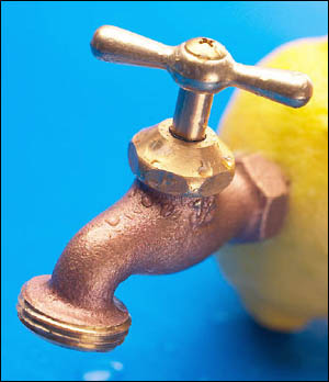 Freshly squeezed lemon is great for a liver cleansing juice diet: Funny picture of lemon with tap on it.