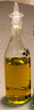Bottle of olive oil. Include good quality olive oil in you liver cleanse recipe.