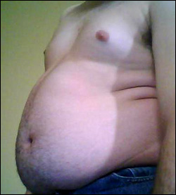Overweight is often linked to too much fat in your liver. Picture of stomach on overweight man.